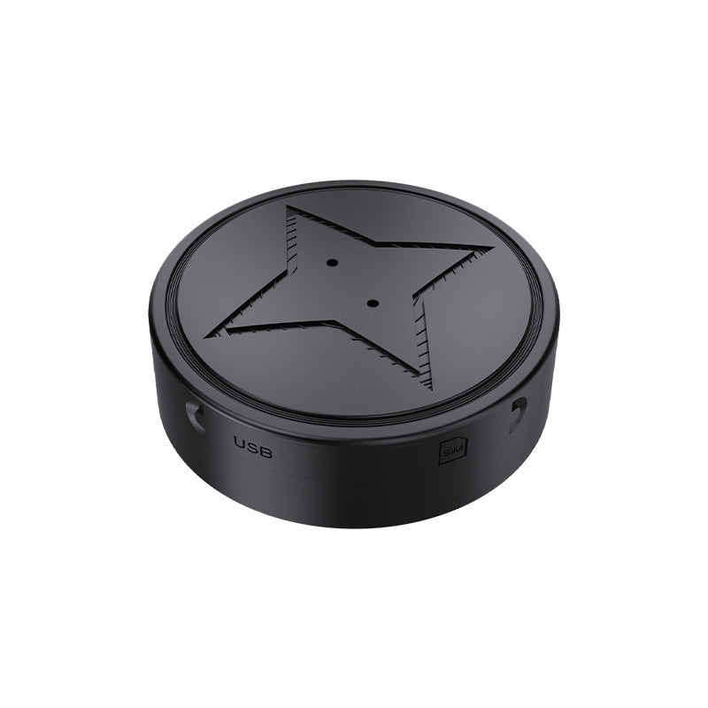 Black circular device with star design on a white background